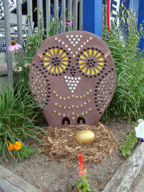 a concrete owl sculpture