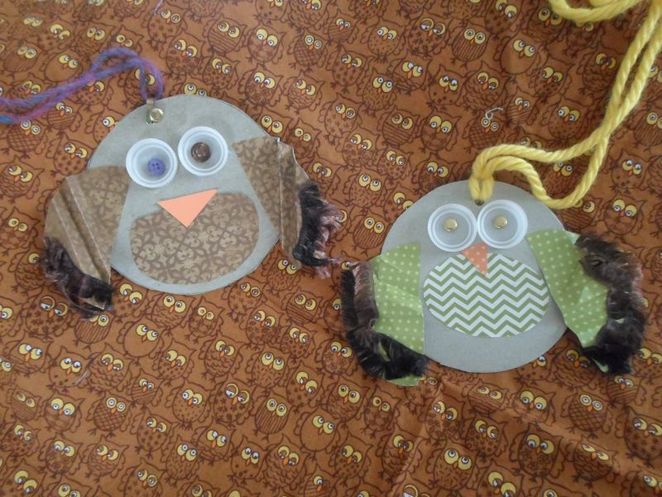 Two owl necklaces made from recycled materials