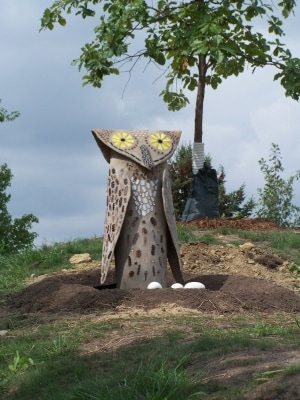 a concrete owl sculpture