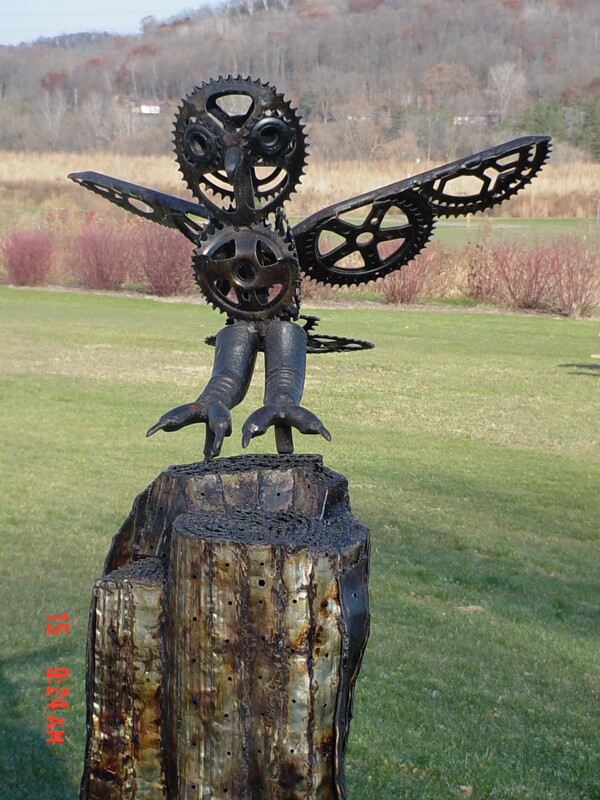 an owl made out of bicycle parts